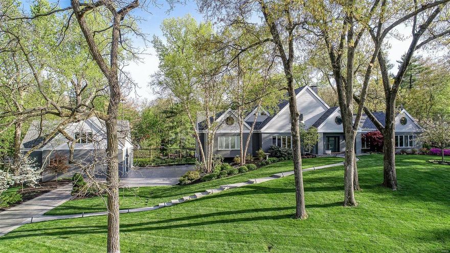 Stunning contemporary estate with incredible architectural features on a beautifully landscaped 1.42 acres. Chef's kitchen with center island, top of the line appliances and breakfast room. Great room with custom built-ins, gas fireplace, and wet bar. Formal living and dining rooms plus an office with custom cabinetry . Main floor master suite with enormous walk-in closet and huge bathroom with double vanity, walk-in shower and separate steam shower. Main house has three additional bedrooms and two baths on the upper level. Lower level includes recreation/exercise room, 1-1/2 bathrooms, loads of storage and access to the attached 2 car garage. Spectacular detached car collector's garage holds 4 cars plus a 5th on a lift and offers a beautiful 1-bedroom apartment with kitchen, full bath, living/dining area - perfect for in-laws, nanny, college kids and guests. Beautiful patio with custom outdoor Viking kitchen and gorgeous in-ground pool and water feature - truly an oasis!