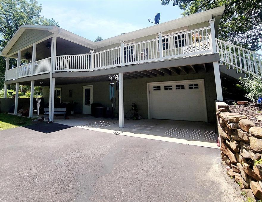 You won't find a more meticulously maintained home than this one! The upgrades & superior quality are everywhere. Hardwood and tile floors throughout the main floor, custom cabinets, built in shelving is just a few of the features. This 3 bedroom 2 1/2 bath finished walk-out basement house has many areas to enjoy. Step outside the sliding glass doors to the covered back wood/composite deck to enjoy the 4.4 acres of oasis this property has to offer. Includes a 2 car detached garage w/work area & for change of scenery another covered patio area. Full paved driveway, stone paths,mature trees & lots of extra parking complete this breathtaking home. Beautiful landscaping provides the outdoors of this home with some of the best curb appeal. This house is well maintained and sure to please, call to schedule to make this one yours and enjoy it just as much as the current owners have!