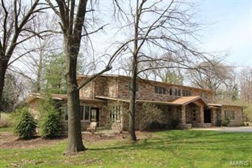 Completely renovated & expanded Mid Century modern home is nestled on almost an acre on  private Ladue st.
Meticulous attention to detail is pervasive with artisan quality materials & the highest quality finishes.
Gorgeous Brazilian mahogany handcrafted doors, cherry hardwood flooring, stucco wall treatments &natural stone
are found throughout this residence. Main fl master suite plus 4 upstairs bedrooms are completely renovated with new baths, built in closet organizers & newer windows. 
The gourmet chef will be delighted, kitchen selections featuring Wolf cook top, pot filling faucet,Wolf double oven & hood. 2 sinks, Sub Zero refrig & Miele d/w. Leather honed finish on the granite counters. 
Fabulous outdoor space incl a 7 yr old  salt water pool, covered patio w/ Italian tile surfaces & ceiling fans. Thoughtful landscaping design to maximize privacy and enhance views.  Huge bonus room!! Flexible space over the garage may be used as an office, studio with a full bath.