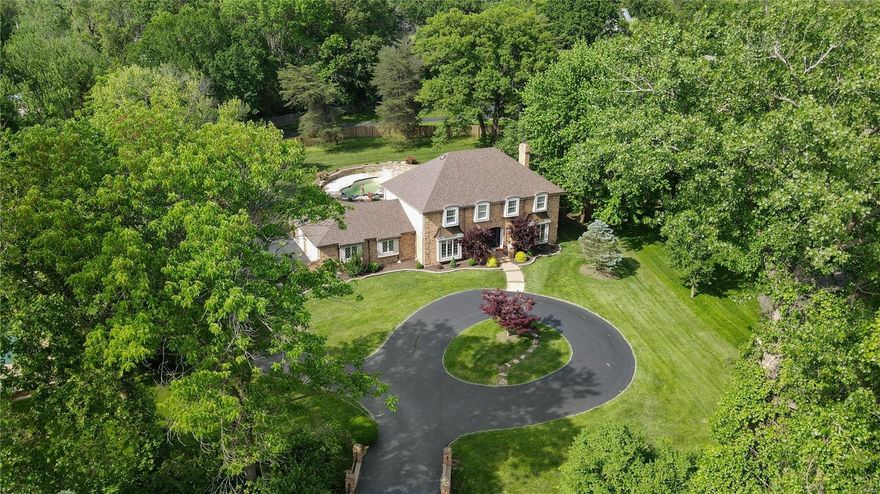 Welcome home to 6 Clayton Hills in Town and Country where your lovely, updated brick beauty sits on over 1 acre with a circle drive and an INGROUND POOL with pool house style sunroom addition (granite wet bar with wine cooler and built-in ice maker) to accommodate the indoor/outdoor entertainment factor! This 5 bed 4.5 bath home is bright and open with a giant kitchen that includes beautiful custom cabinets, granite tops, and SS appliances (double wall oven, electric cooktop, microwave, dishwasher and custom fridge). The finished basement just adds to the amazing living space in this home. This is priced to move and centrally located (within 20 minutes of everything)!  Make your appointment today! Additional Rooms: Sun Room