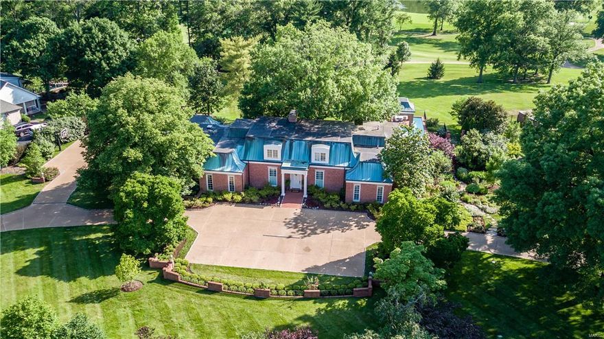 Quality construction & attention to detail abounds in this fantastic home overlooking Bellerive Country Club's golf course. This is a rare opportunity to find a one-of-a-kind home boasting French architecture including a copper mansard roof with rich patina. The current owner, in cooperation with architects Heine & Croghan, completed a major renovation of the property 8 years ago, including an addition to expand the master bath suite with barrel ceiling, his & hers baths and dressing areas. The back staircase was relocated to create a graceful entrance to the stunning lower level, including a wine cellar, putting green and locker room, exercise room, kitchen, 2 full baths, & a massive space to entertain with walkout access to the pool. Exceptional hardscaping & gardens make this an entertainer's dream. The 2000+ sq ft brick patio is shaded by the canopy of a massive tree. 9 yrs "new" Pool Tron Pool includes a 60 ft lap lane!  Geothermal heating & cooling, Smart Home, no details missed!