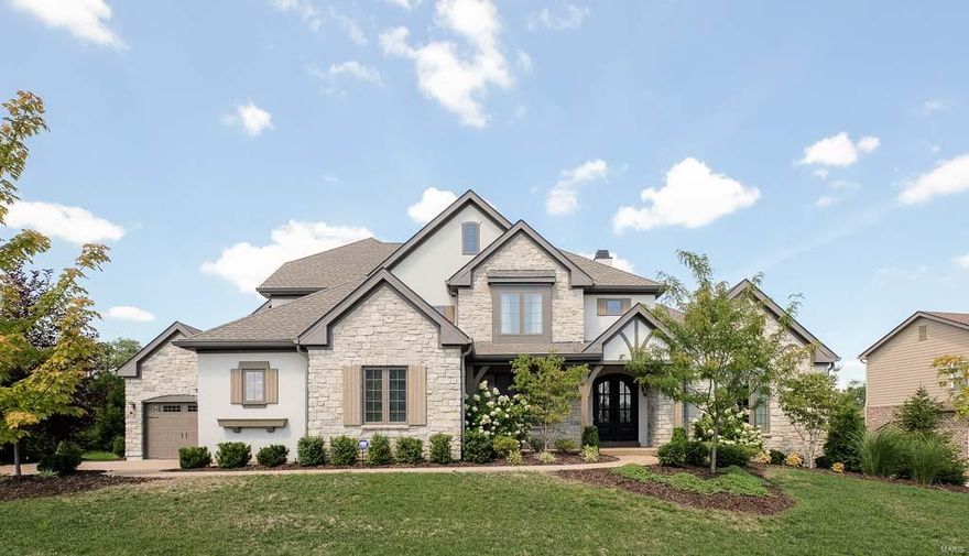 Awesome McKelvey display -approx 2 yrs.-Stone Front, Arched dr entry, Hardwood flrs, study w/ double glass drs and vaulted ceiling, Grt Rm. vaulted, custom beams,dormer windows, hardwood floors, Extensive millwork, recessed lighting, stone fireplace/raised hearth, Walk out to extended covered porch, wine bar with under counter ice maker and cooler. Open kitchen, breakfast Rm/Hearth Rm.,Gourmet kitchen W/ Decor Stainless appliances, six burner gas range, build in Micro and convection oven, (2 ovens) huge Island W/ breakfast Bar,Recessed lighting and surround sound, Laundry Rm./ with storage cabinets, Family foyer with drop off area bench and planning area.  Master Suit W/coffered ceiling, crown moulding,Bath featuring glass shower with programable shower heads double adult height vanity.  Upper level- has Two additional bedrooms share Jack and Jill bath and Third bedroom with a private bath, all bedrooms with walk in closets and large loft area with built in refrigerator and microwave. Additional Rooms: Mud Room