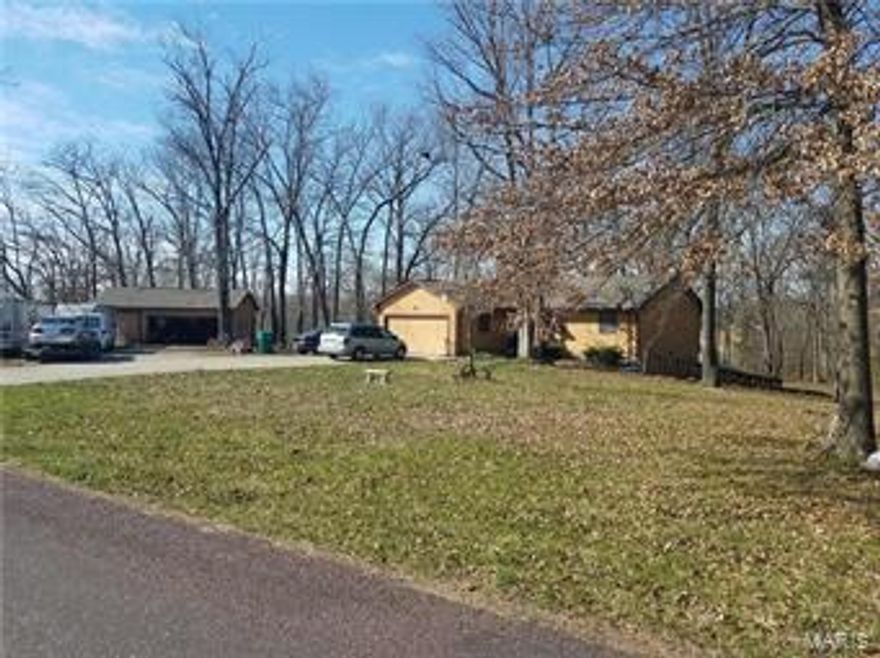 Home Needs TLC but has Great Possibilites - Bright & open describes this 4 total bedroom 2 bath Ranch on 1.5 acres with 5 car garage.  Huge windows overlook the peaceful timbers of Woodridge Lake Estates featuring a 40 acre community lake & pavillion.  Open floor plan of the kitchen, breakfast & family room providing plenty of entertainment space! Kitchen features custom oak cabinets with lazy susan. Walk out Lower level has 1 bedroom + Office & 1 full bath as well as plenty of storage.  32x28 detached out building.  Other amenities include: Anderson Windows, Attic Fan & Wood burning furnace that has barely been used.  Newer Water Heater & water softener.  Newer Furnace & AC installed  and newer roof!