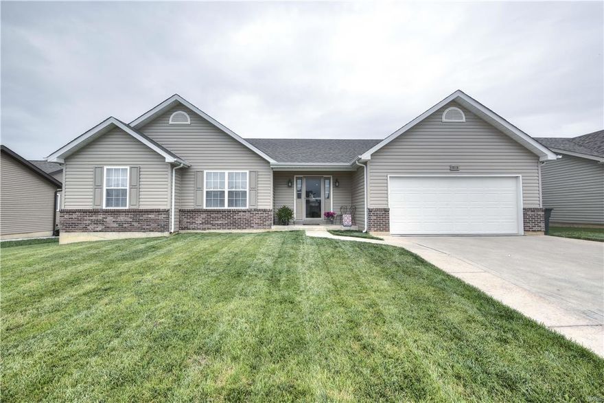 This nearly new 4 BR/3BA home is perfect for the growing family! The open floor plan is ideal for the discerning buyer who loves to have friends & family over. Cathedral ceilings, built-in bookshelf w/lights & stone surround gas f/p in your great room add to the charm of this well maintained home. Kitchen is perfectly appointed w/gorgeous wood floors, dining space, center island, tile backsplash, SS appliances including smooth top range. The large master bedroom suite includes a large master bath w/corner soaking tub & separate shower as well as double bowl vanity. Two additional large bedrooms share a full bath w/tub-shower combo. Be sure to check out the awesome finished LL complete w/theater room including stadium seating, projector & screen. There is also a large rec room, bar, full bath & bedroom...your friends will never leave. Large backyard on this premium lot means no one will be building behind you! This room is waiting just for you! Come see it today!