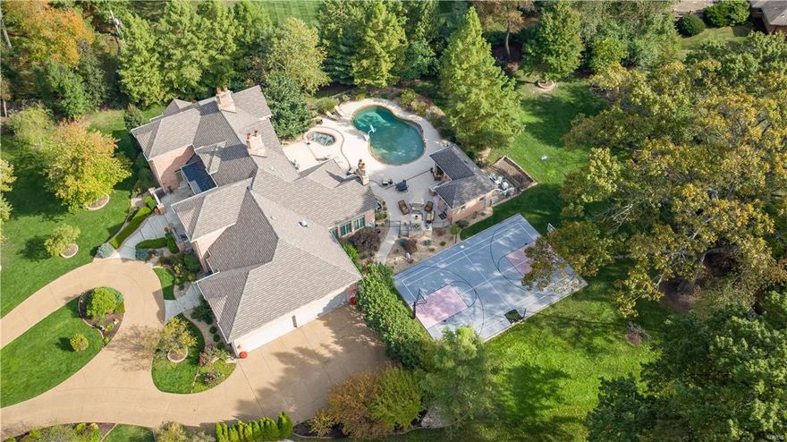 *Must see drone tour* Welcome to #7 Georgian Acres, a custom fortress perched atop a secluded l+ acre lot in the heart of Frontenac. Impeccably maintained, this unassuming acropolis was creatively designed and perfectly positioned for optimal outdoor privacy around pool, pool house, covered kitchen/bar, stone fireplace, inground spa & sports court - no detail overlooked!  These lavish outdoor spaces were intentionally designed flowing beautifully into the hearth room and kitchen for ease of entertaining.  Great Room takes center stage at front entry with show-stopping floor to ceiling windows and french doors opening to pool area.  Main floor master wing with sitting area, fireplace, generous bath, walk-in closet and an office fit for a king.  3 addt'l en-suite bdrms and shared open study area complete 2nd floor.  Fabulously appointed LL boasting rec room with fireplace, fully equipped bar, half bath, dramatic theater, wine cellar, and an impressive fitness area with steam shower! Additional Rooms: Mud Room