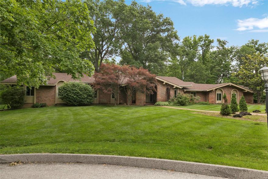 Brand new state of the art kitchen + steam sauna! This 5 bedroom 4 full baths and 3 1/2 baths one story home is situated on a beautiful and very private 1.8 acre lot in the heart of Ladue.  Extensive renovations & additions feature 2 new kitchens & 6 baths.  There is also a newer roof, windows, flooring and landscaping. It's open and spacious floor plan features a stately entry foyer with  sunken-living room with custom built in bookcases, flex spaced formal dining room which can be used as a home office, schooling area or media area.  Spectacular great room with fireplace, contemporary kitchen with separate breakfast room and first floor laundry room. Main level has 4 bedrooms, the master suite features a marble steam shower and extensive closets. The lower level offers additional bedroom (ideal au pair space), pool kitchen, large family room, den with bar and 2nd fireplace, and cavernous storage. The secluded pool area provides a lovely retreat with near total privacy year-round. Additional Rooms: Mud Room