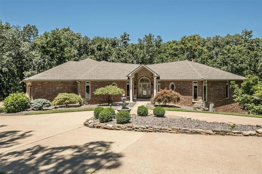 Discover serenity just 15 minutes from 270 & 44 in the heart of Greenfelder Park within prestigious Bridlespur Estates. This expansive 6,000 sf, 3 ace retreat is the perfect blend of city proximity and country tranquility. Custom architecture and exquisite millwork define this sanctuary.  The main level features a glorious great room with expansive 10' windows, a dream kitchen complete with butler's pantry, a cozy hearth room, and sun-kissed 4 seasons room. The owner's retreat offers a tranquil escape with its own fireplace, sitting room, and private veranda. Admire elegant ceiling details, luxurious hardwood floors, and 4 fireplaces. Lower level family fun center features state-of-the-art theatre, crafted by an Emmy-winning sound producer! Full bar also serves as a 2nd kitchen with Fisher&Paykel dishwasher, fridge, beverage fridge, 2 burner stove & warming tray.  Plus 2 ensuites & fourth bdrm. Walkout patio opens to flagstone patio. Your paradise of privacy awaits! 3 sides brick/stone Additional Rooms: Sun Room