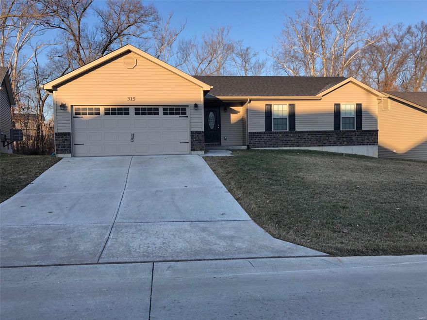 This NEWER 3bed/2bath ranch has every upgrade you could imagine! They include vaulted ceilings, rounded corners, quartz countertops, stainless steel appliances (including fridge), maple cabinets with "soft close", ceramic tile (in kitchen, baths, laundry), custom neutral colored paint job throughout, MAIN FLOOR laundry, framed windows, taller baseboards, adult sized cabinets in bathrooms with marble countertops, walk-in closet, upgraded carriage doors on an oversized 2-car garage with openers, 6 panel doors, and upgraded water/light fixtures throughout the house!