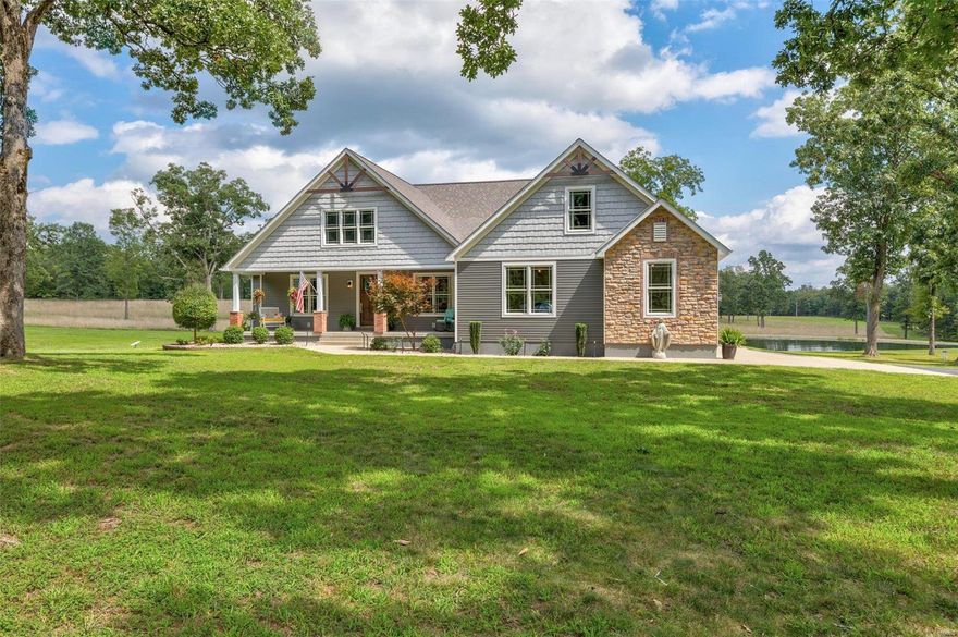 As you explore the 70 acres of pristine land that surrounds this estate, imagine enjoying serene sunsets by your 1-acre fully stocked pond, teeming with bluegill and catfish. The 30x40' astroturf patio beckons you to unwind next to the sparkling inground pool, complete with an outdoor kitchenette. The handmade fireboulder sets the perfect ambiance for gatherings under the stars. Inside, this 3,526 sq ft masterpiece features 5 bedrooms & 4.5 bathrooms. The stunning primary suite is a sanctuary of its own, boasting an 8' granite center island in the closet & a lavish bathroom with a 5x10 custom tile shower. Embrace the future with solar panels that make electric bills practically disappear. With 2 horse stalls & 7 garage spaces, the 40X60 Morton Building is a haven for those with equestrian pursuits or a penchant for vehicles and storage. 495 Buzzard Rock Rd seamlessly merges modern luxury with the tranquility of nature, offering a lifestyle that's truly unparalleled.