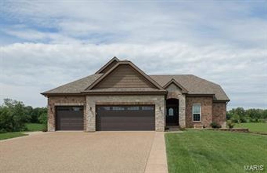 Custom built home on 3 acres.  Three, oversize car garage with openers.  The home features 9 foot and 11 foot ceilings thru the whole house.  Great room has stone set in for future fireplace.  Kitchen features center island, custom cabinets, granite counter tops, walk in pantry,  stainless steel appliances and eat in breakfast.  Split floor plan with master bedroom with custom, 8x10 walk in closet.  Luxury bath with separate shower and whirlpool.  Master bedroom is 13x21. 20x20 patio off breakfast room.  9 Foot basement pour with walk out, bath ruff in and framed up, patio off walk out.