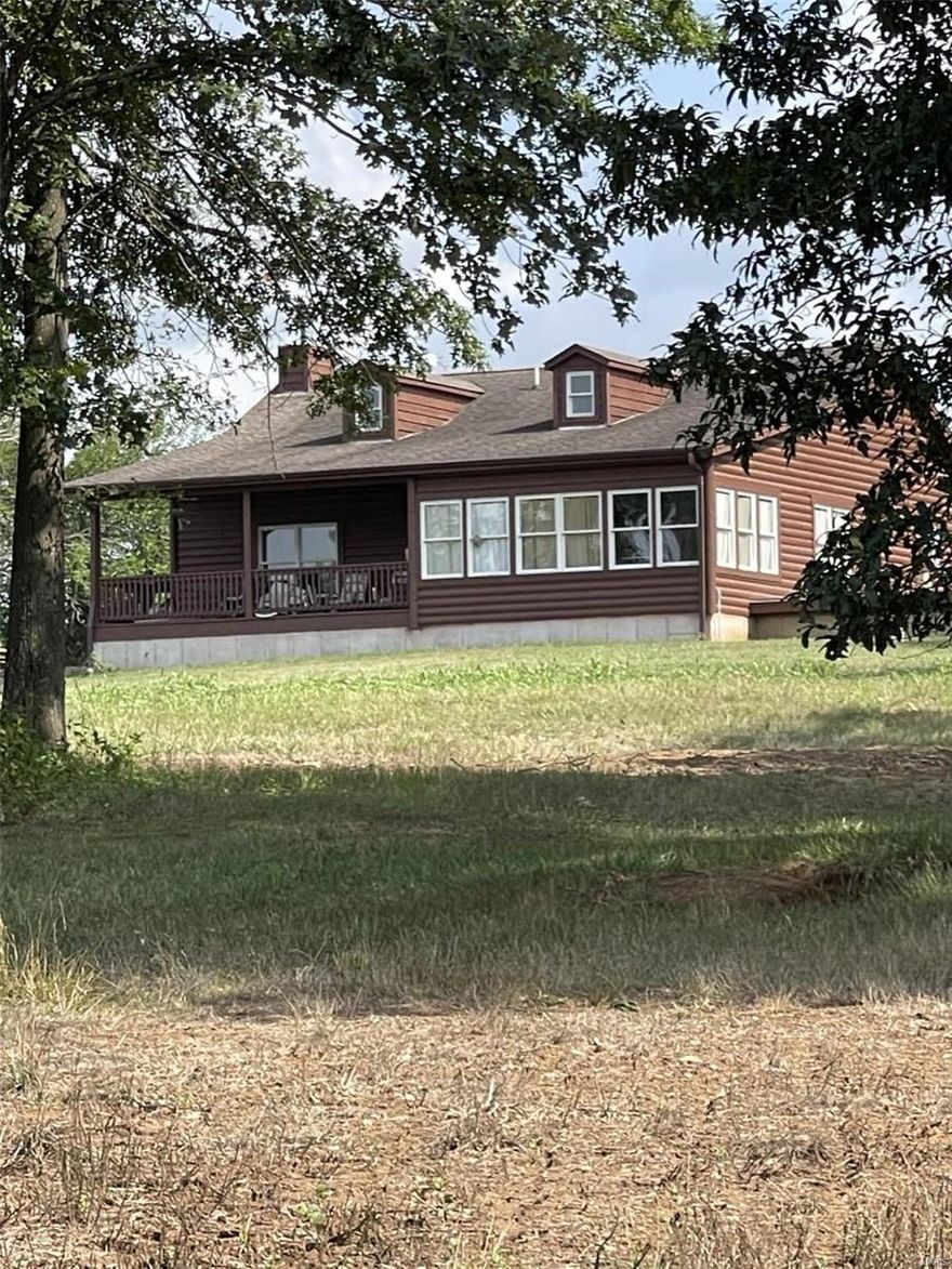 Check this listing out! Truly, a once in a lifetime chance to own your own farm and all the equipment to maintain and enjoy your slice of heaven.  A picturesque log cabin overlooking a fully stocked 6-acre lake.  The home was built in 2007 and has been well-maintained as well as the equipment which conveys with the land. Farms like this and the layout as well as how much care the owners have taken to enrich its natural beauty does not come along often. Schedule a showing today and see for yourself the investment you will be making along with memories of hunting and fishing with your family and friends.