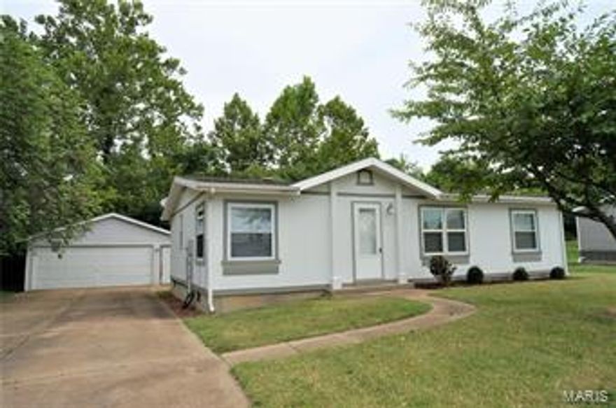 This adorable ranch home features 3 bedrooms and 2 full bathrooms. The home sits on a nice level lot with a detached oversized 2 car garage and extended driveway. Walk inside and notice the open floor plan, vaulted ceilings, and newer carpet throughout. The kitchen has been recently updated with new flooring and all appliances to stay. Newer windows and water heater as well. Main floor laundry off the kitchen with access to the backyard. You'll appreciate the split bedroom floor plan for more privacy. The master bedroom features a walk in closet and full bathroom. The other two bedrooms are spacious with generously sized closets. The hall bath has been updated with a new tub/shower surround and modern vanity. Choice Ultimate Home Warranty Included! Make an appointment today!