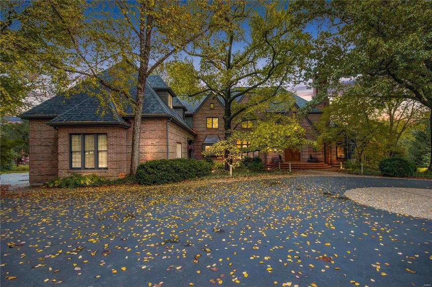 Welcome to Serena Hill! This stunning brick home in Ladue Schools has everything you need for your luxury lifestyle. Sitting on 1.5 acres, with nearly 8,000 sq. ft. of living space, every detail has been thoughtfully crafted: 5 fireplaces, a gourmet kitchen w/state-of-the-art appliances, gleaming hardwoods, custom millwork and built-ins, archways, columns, and stylish lighting. The main level is an entertainer's dream, with a formal living and dining rm, gorgeous kitchen and breakfast rm, two-story family rm w/floor-to-ceiling stone fireplace flanked by windows, guest rm & laundry. The master suite is a retreat with a sitting rm, wet bar, fireplace, and bath w/Jacuzzi tub. Upstairs is a family loft and 3 more bedrooms, each w/ an en-suite bath. Relax in the finished LL with a rec rm, game space, office, home gym and even a built-in slide! Enjoy your own private oasis with a deck and hot tub that overlooks the beautifully landscaped pool area with a waterfall and manicured lawn beyond.