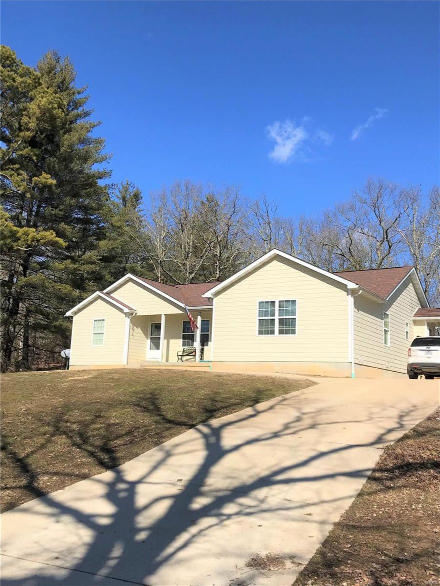 Come home to Cook Station. 8 year old home is open and inviting with cathedral ceilings, custom kitchen w/exceptional cabinetry, center work island/breakfast bar. Living area has French door that opens to the deck /pool area. Master suite has his/her walk in closets and a large master bath complete with walk in shower and separate tub. 2 bedrooms, a spacious hallway bath, and large laundry room complete the home. Exterior boasts hardy siding, a covered front porch, concrete parking pad. Enjoy the view of the valley from your front porch. Lawn has been landscaped. The shop w/attached lean-to has concrete floor, heat, garage doors with openers. Land is a good mix of woods and creek bottom pasture and has been fenced. Taff creek runs through a portion of the property. There is also a year-round spring. Many mature whitetail deer have been taken from this property.This exceptional piece of private paradise is truly a one of a kind find.