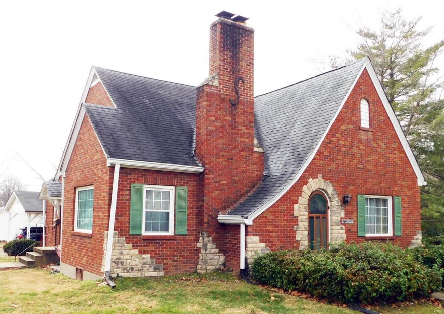Beautiful 1930's 1.5 Story, 4 Bedroom home with oversized 2 bay carport. Beautiful hard wood floors under carpeting. Windows have a lifetime, transferrable warranty. House has been maintained very well, added 2 sump pumps in basement so it is very dry. Basement is very large and where this family used to have 60 people over for Thanksgiving. Lots of love here. The upper level has 2 very large bedrooms a half bath, 2 large storage closets and a whole stroage room behind the bedrooms. The main floor has a beautiful stone fireplace a large Family / Living Rm., formal Dining Rm., eat in Kitchen with historical custom cabinets. There is a ton of historical details on this home that are treasures like the rounded front door and 5" baseboards.  This house is part of an estate and is being sold "as-is". Please use Special Sale Contract. All contracts are due Monday at noon. Please make a 6 p.m. response time for Jan. 24th. "MAKE AN OFFER" ESTATE SALE and OPEN HOUSE SUNDAY JAN. 23rd 1-3 P.M.