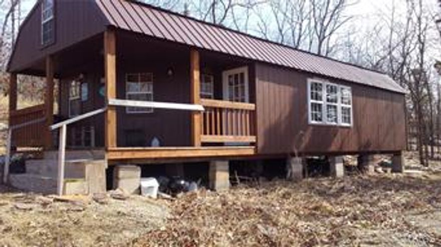 Nice newer cabin, set up to enjoy your family weekends. 2 lofts for sleeping area. Nice cabinets. Bathroom is installed but water and sewer are not. Nice deck with great views of the mountains. 107 +/- acres, no timber harvest in recent history. Seasonal creek, joins government Taum Sauk state park. Great recreation property!