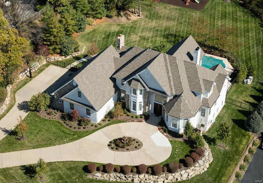 NEW PRICE! Executive 1.5 story home near some of St Louis' best shopping, restaurants, theaters & highways. Steps to Edward Jones World headquarters and Mercy, Missouri-Baptist & Des Peres Hospitals. Every convenience has been considered in the upgrades and improvements made by sellers, totaling $500,000. 7,600+ SF of total living areas. Unique benefits include an attached Guest Quarters complete w/kitchen. Floors are job finished. The kitchen boasts Viking & SubZero appliances. A main level Master features organized his and hers closets. 3 oversize BRs on 2nd. Lower Level is walkout and above grade, and features custom Tony Probst home theater, exercise room, and rec/living rooms, full bar w/wine cooler & fridge. A resort setting is made complete with saltwater gunite pool w/kool deck and magnificent level, fenced yard complete w/pristine landscaping, state of the art lighting & surround sound systems. New roof, 2011. 4-car garage, with space for 5 vehicles and storage.