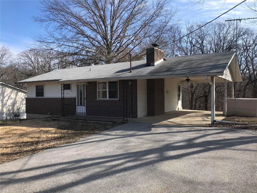 2 bedroom one bath home on a quiet street that backs to wooded area. Walkout basement that leads to a small concrete patio. Wood  burning fireplace in living room. Please use a special sales contract when submitting an offer. Being sold as is.