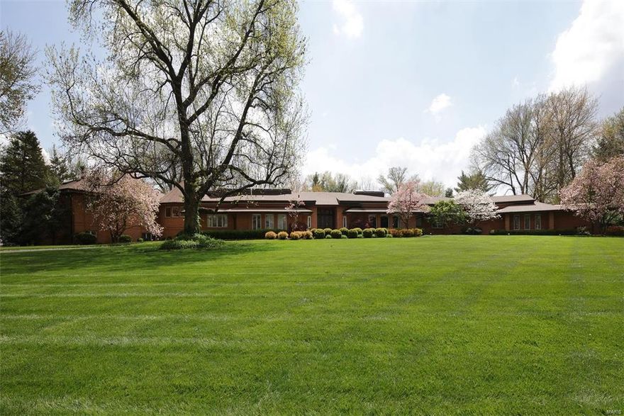 One of a kind sprawling 5BD, 5.5 bath ranch on a level, wooded 1.51-acre site in Ladue Schools.  Approximately 7,465 SF of living space on two levels complete with swimming pool, indoor hot tub plus Home Protection Plan.  Updates by current owner include media room, remodeled living room, game room, guest bathroom, pebble tech surface to pool, extensive professional landscaping, space added to rear deck and replaced fence.  Amenities include 20' x 9' marble entry, center island Italian granite kitchen with both gas and electric cooktops, step-up master suite with sitting room, two walk-in closets plus dressing area with full length mirrors plus marble bathroom with jetted tub.  Notice the four sides brick exterior, 4 car heated garage, sprinkler system, security system, 5 zones HVAC,multiple skylights in kitchen, hallway, and master bath, 25' x 16' domed hot tub area, and wonderful 27' x 23' lower level walkout rec room with kitchen plus shower and two changing areas.  Amazing home! Additional Rooms: Mud Room