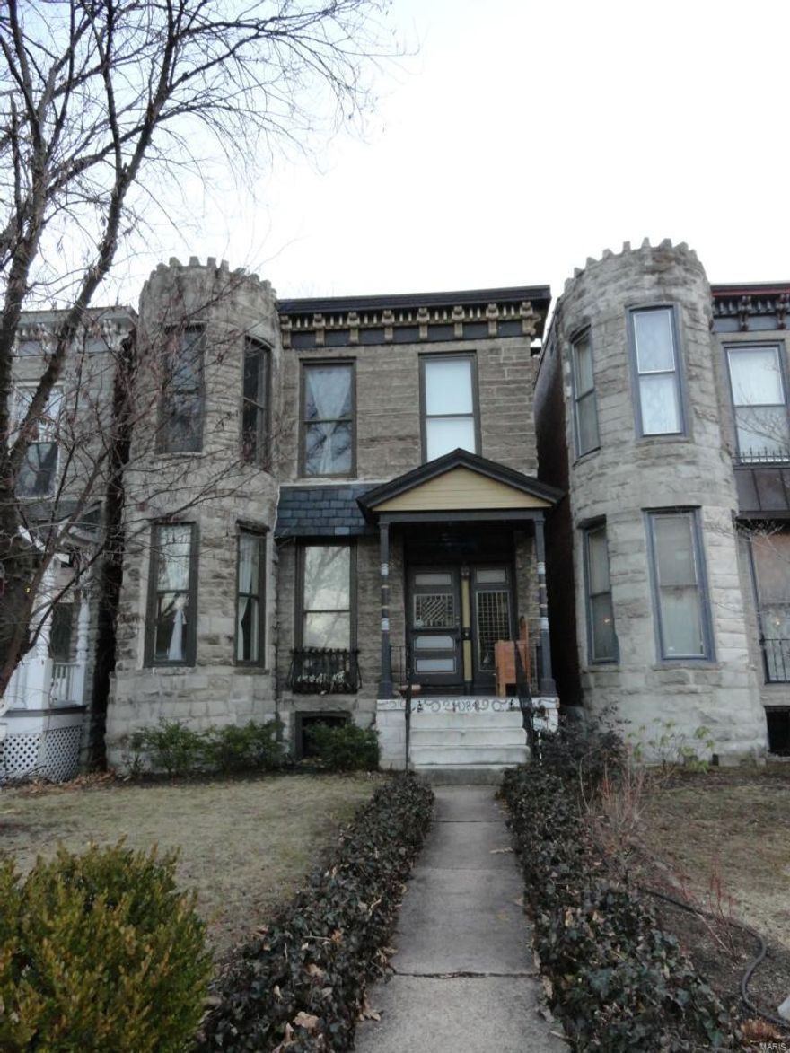 JUST REDUCED AGAIN!! Where modern amenities and historical charm meet.  You will love this 3 bedroom home located within walking distance of all that the Central West End has to offer.  You are greeted with a large foyer with a spindled staircase, historical moldings, beautiful cherry wood floors and 9’ ceilings.  The foyer leads you into the living room with a fireplace and bay window.  There is plenty of entertaining room in the large dining room and updated kitchen with 42” cabinets, built-in pantry and slate floors.  The first floor is complete with a half bath for your guests. The 2nd floor provides 3 bedrooms with a 4th room that is currently used as closet or can be turned into a small office. It also includes a full bath, transoms with stained glassed over most of the doors and a fireplace in the master bedroom.  In the Spring, enjoy relaxing on the back deck overlooking the fenced yard and one car garage. Home to be sold in AS IS condition.