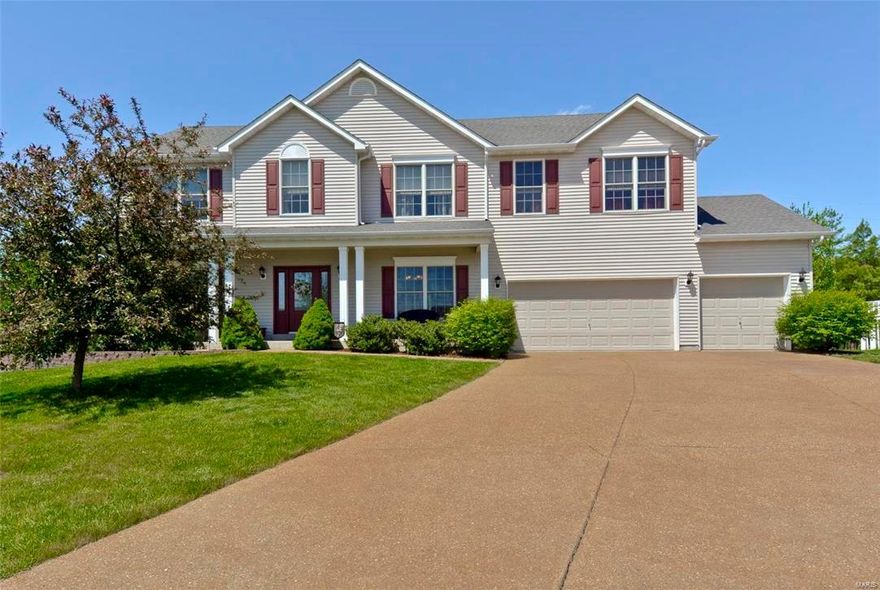 NEW PRICE!!!Fabulous two story home located in popular Villages of Dardenne, just off Hwys K/N.  Located on a cul de sac, this spacious home (2886 sq ft), includes 3 car garage, .4 acre fenced yard, 4 bedrooms, 2.5 bathrooms and so much more.  Features include:  NEWER Carpeting (4/16), 9 foot main floor ceilings, wood burning fireplace, bay windows in the great room and breakfast rooms, 6 panel white doors, upstairs bonus room, hard wood entry, millwork, and so much more.  The kitchen has 42 in Oak cabinets, large center island, smooth top stove and some pull out-drawers. The master suite is huge, with luxury bathroom with dual sinks, garden soak tub, shower and 2 walk-in closets.  Two secondary bedrooms have walk in closets and the 4th bedroom has 2 side by side closets. The backyard is fenced with large patio great for a BBQ. The neighborhood amenities include 3 theme pools, tennis courts and club house.