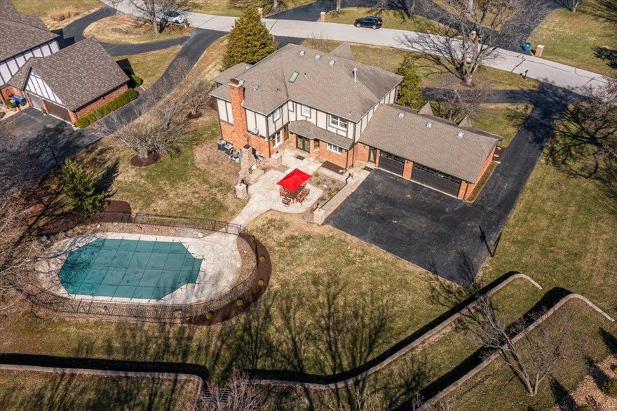 Located in the prestigious Strathmore subdivision of Town & Country, this exceptional Tudor home offers luxury living just minutes from top-rated schools, dining, and shopping. Your outdoor oasis awaits with a saltwater pool & an inviting stone fireplace on the patio—everything your family needs to enjoy the warmer weather ahead. Inside, a grand 2-story entry leads to a freshly painted kitchen that opens to a cozy family room with a fireplace and a charming 3-season room. The finished lower level is an entertainer's dream, complete with a fully equipped bar featuring an ice maker, dishwasher, microwave, & refrigerator—plus a beautifully finished full bath for added convenience. Additional highlights include a spacious 3-car garage, an irrigation system, a security system, custom millwork & thoughtfully designed outdoor lighting to enhance the home's charm and security. This home offers everything you need for comfortable living & memorable entertaining. Additional Rooms: Mud Room, Sun Room