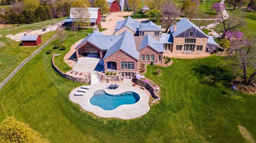 Plenty of room to roam inside & out at RidgeView Farm. This expansive Tuscan-style equestrian estate is surrounded by 90+ rolling acres on the 2nd highest point in Frnkln Cnty. Thoughtfully designed w/ rustic details & reclaimed materials, this light-filled villa brings the outdoors in through walls of glass. The open-plan great room is a perfect spot for friends & family to connect by staying close to the kitchen, din room, & warmed by a stone fireplace. A loft overlooks the great room creating a cozy library or music room. Your private Mstr ste filled w/ luxurious amenities, fine detailing, an immense custom walk-in closet & dressing room. A flexible office/sunroom for quiet creativity features 3 walls of windows.  Step outside to your expansive htd pool to spend a leisurely afternoon soaking & sunning. Conceived for horse lovers, the estate includes 2 barns & outbuildings awaiting you & your herd. Play, ride & explore your sweeping property & relax into your dream country lifestyle.