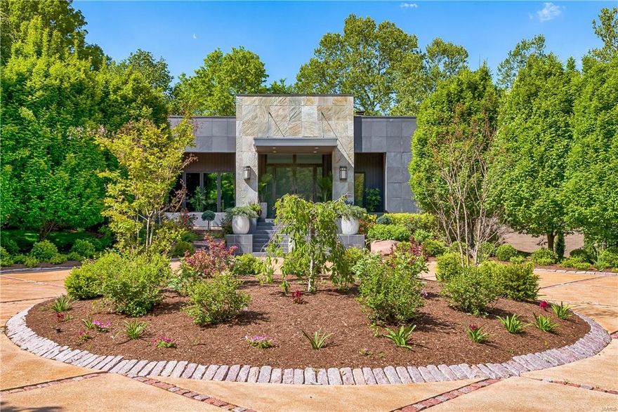 Designed by Arthur Sitzwohl is this stunning contemporary home that has been updated & enhanced.  The moment you walk in this stylish home, you will love the openness & large windows. The main level has beautiful bleached oak. The Living Room has a gas fireplace, built in cabinets & French doors that lead to the slate patio overlooking the pool. The kitchen features granite counters, plenty of cabinets, 5-burner Wolf gas stove, Sub-zero refrigerator & wine cooler & a breakfast room with doors that lead to the back terrace.  The master bedroom suite is private, apart from the other bedrooms & features a den/office & large dressing room with a huge walk-in closet. The bathroom has dual vanities, separate soaking tub, lots of built-ins & a dual head rain shower. 3 other bedrooms & 2 full baths are on the other wing of the home. The walkout lower level features a recreation room that could be a 5th bedroom & another full bath.  The backyard has a saltwater pool, waterfall & hot tub. Additional Rooms: Mud Room