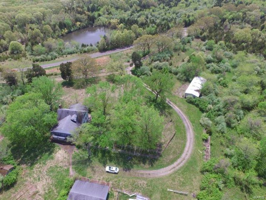 Wow this is a rare opportunity.  Horse property within a short distance of St. Louis. Or just choose to farm with cattle, either way this one is ready to get started.  The home is in need of repairs but appears to have good bones.  The land is absolutely beautiful and the barns and sheds are ideal for someone with lots of animals.  Or this property could be turned into a beautiful subdivision.  The back side adjoins the easement for Highway A and the left and front adjoin city of Hillsboro properties.  This land is unincorporated at the moment.  I would expect that it could be friendly annexed into the city limits of Hillsboro if purchaser chose to do so.  This one is sure to go fast!  There is a sizeable pond on the back toward Highway A.  Acreage is taken from tax records buyer is encouraged to do boundary survey to verify acreage.