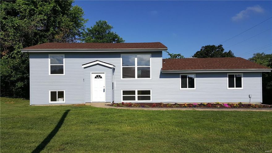 Unique find with this UPDATED home w/2 COMPLETE KITCHENS, 4 bedrooms with over-head lighting and nice-sized closets, 2 full bathrooms and oversized 2 car side entry garage.  Enter the foyer for a complete home up and a complete home down with locking doors.  As you enter each home you see brand new carpet in the family rooms, hall and all bedrooms.  The kitchens boast NEW CABINETS, even a lazy-susan, TILE floors, NEW appliance and nice-sized eat-in area.   The upper home has a covered deck and the lower level has a 3 season sitting area. There are 2 HVAC’s so both units control their own comfort.   This move-in ready home boasts NEW WINDOWS, ROOF & SIDING!  Large yard and patio for your outdoor enjoyment.  Must see to appreciate!