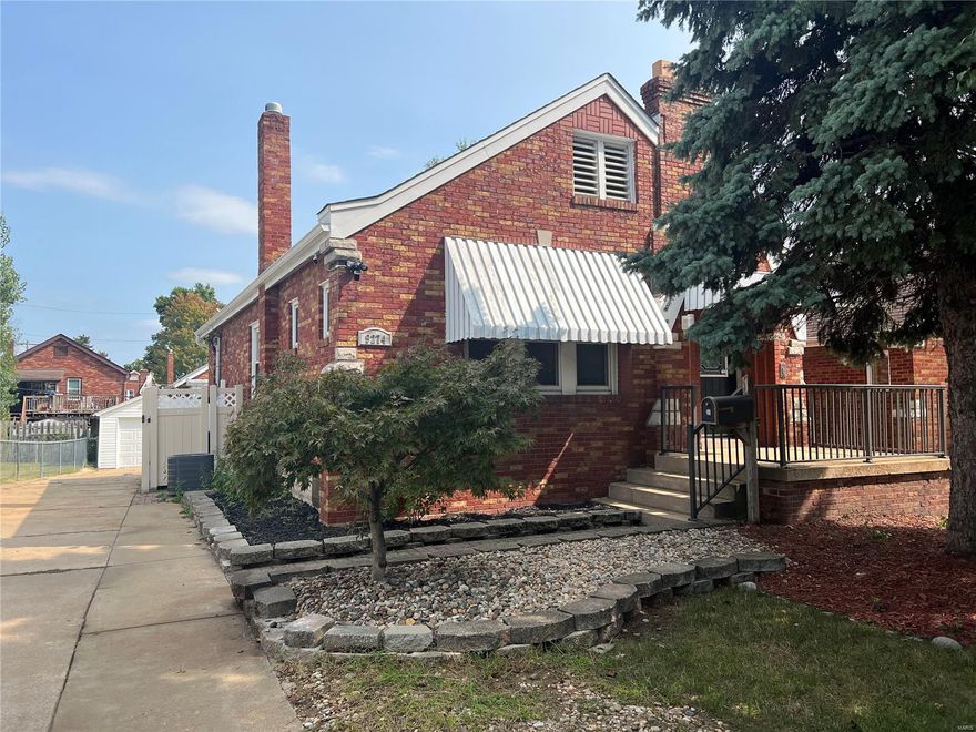 This beautiful brick home is just so darn charming! When you first see it, you'll notice the well-kept landscaping and inviting porch that gives off great vibes. Once you step inside, you'll be welcomed by a big living room with lovely wood floors and plenty of sunlight pouring in. From there, you can mosey on through to the dining room, and you'll find a cozy kitchen with cool tile backsplash and lots of cabinets.

On the same level, there are two good-sized bedrooms and a full bathroom – plenty of space for everyone. If you head downstairs, there's a partially finished basement where you'll find a comfy family room and another bathroom.

Don't forget the deck with a nice view of the backyard. There's a detached garage and carport so you'll always have covered parking. This home is like the perfect blend of classic charm and modern convenience, making it a cozy and inviting place to hang your hat. Don't wait, schedule your tour today! Sold "As-Is"