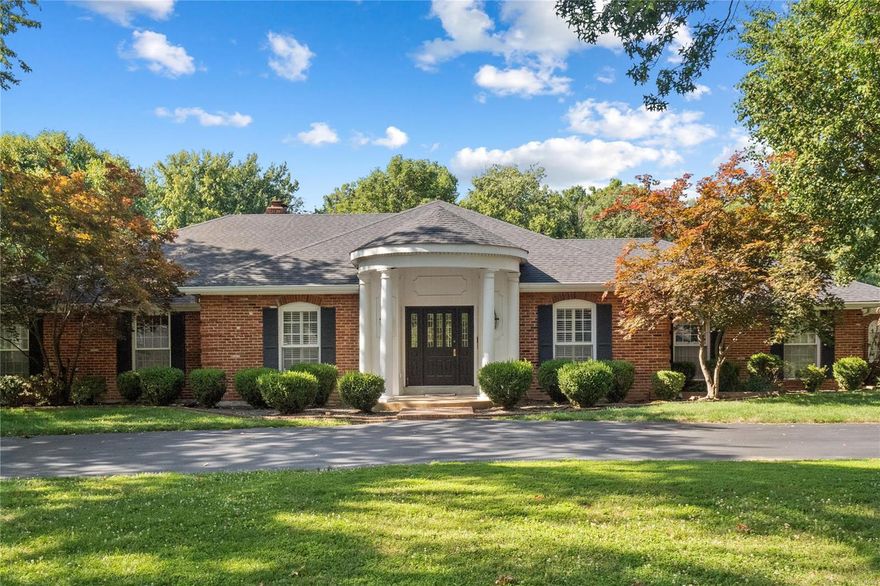 This stately home is in the heart of Town & Country. You enter the elegant foyer with hard wood flooring & begin to see the special features found throughout the home: 9’ ceilings, crown moldings, built-ins in the paneled family room & French doors leading out to the patio. The generous eat-in kitchen has an abundance of cabinetry, countertop space & two pantries. A swinging door from the kitchen flows into the formal dining room. The living room & adjacent family room with a gas fireplace & bar have ample room for entertaining. The primary bedroom has an ensuite bathroom with a Roman Tub, separate shower and two walk-in closets. The 2nd, 3rd and 4th bedrooms are off the main hall, along with a full bath. The lower level is stubbed out for another bathroom, with two sump pumps and a French Drain. There is a 3-car garage, a main floor laundry room and a flat acre-plus yard. The floor plan is impeccable. Any updates you do will bring out the full potential of this beautiful property.