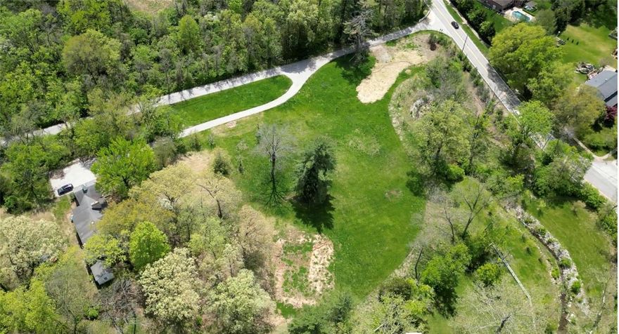 Located in a prime Town and Country location, the 5.85-acre private, wooded property is horse-friendly and features scenic views immediately adjacent to Queeny Park, with no major roads to cross for access. It offers excellent proximity to highways, hospitals, shopping, restaurants, and top-rated schools. This is an ideal opportunity to custom build in a close-in, equestrian-friendly setting—an attractive prospect for builders, developers, or individual owners alike. 
If interested in a larger parcel, this property may be combined with the 6.51-acre property at 1004 Weidman Road, located just to the north, totaling 12.36 acres.