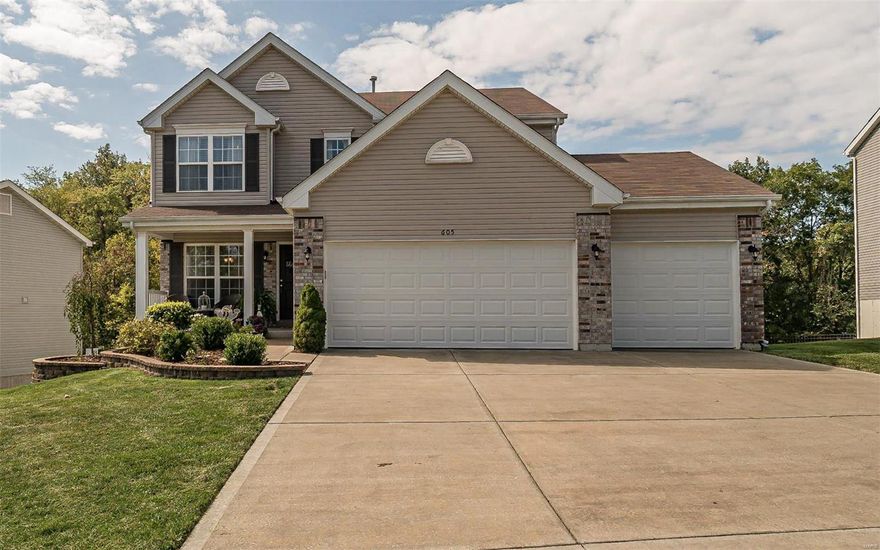 Super 2 Story. Great curb appeal. Professionally landscaped with beautifully tiered walls, large covered front porch and an oversize 3 car garage which was extended on one side. Enjoy the clean lines and lots of windows for natural light. Hardwood in foyer, kitchen and breakfast area. Kitchen has a center island with lots of custom cabinetry plus features like crown moldings, glass door corner cabinets, staggered heights and a beautiful tile back splash. Double door pantry. Main floor laundry. Upstairs is a great sitting/tv area. Huge master bedroom with 2 closets, a luxury bath with double sink, a corner tub with window overlooking woods, plus a glass shower. Hall bath also has a double sink plus a transom window. There are sliding doors off the breakfast area to a super private deck with an Arbor that overlooks woods. Steps lead from the large deck to a patio off the walk out lower level. Chrome handles hinges and bath plumbing fixtures! Hurry this gem will not last!