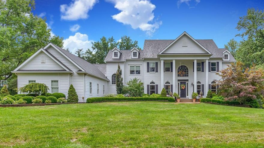 Grandeur meets function in this Town and Country home that caters to both casual and formal entertaining. Soaring ceilings and lovely millwork are evident at every turn such as the coffered ceiling in the DR and built-in bookcases in the LR. Everyone always ends up in the kitchen and thankfully this kitchen can handle it! Thermador appliances (including 2 dishwashers!) a huge island and an adjoining vaulted hearth room with a stone fireplace is pure perfection for cozy family gatherings or the largest of affairs. There is a first floor primary suite and upstairs are two sets of bedrooms with jack-n-jill bathrooms. Stone columns dot the finished LL that offers a rec room, theater room, and kitchen, all of which flows out to a private oasis.  Stately wood accents the covered porch with a bar/grill area that looks out to the saltwater pool complete with sunning decks, fountains, and a waterfall. Stunning landscaping, 1st & 2nd floor laundry, 4 car garage, irrigation, and a brand new roof! Additional Rooms: Mud Room COOL: 14 SEER+