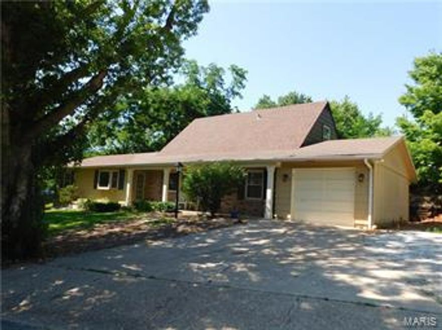 Feels like country but centrally located in town. This all steel studded home sits on 1 acre m/l surrounded by mature trees and beautiful landscaping on a dead end street. Beautiful home inside and out has lots of updates with the highest attention to detail. 
Features include vinyl tilt in windows, three bay windows, 3D roof, crown molding, six panel doors, custom ceiling work and hardwood floors. The eat-in kitchen has inlaid limestone counters & backsplash, raised panel maple cabinets, ceramic tile flooring, a large pantry full of drawers, deep pan drawers and custom lighting including under cabinet lighting. Built-in bookcases in dining room. Zoned heating and cooling (2 furnaces & 2 central air units). Enjoy the privacy on your back patio. Much more!!!