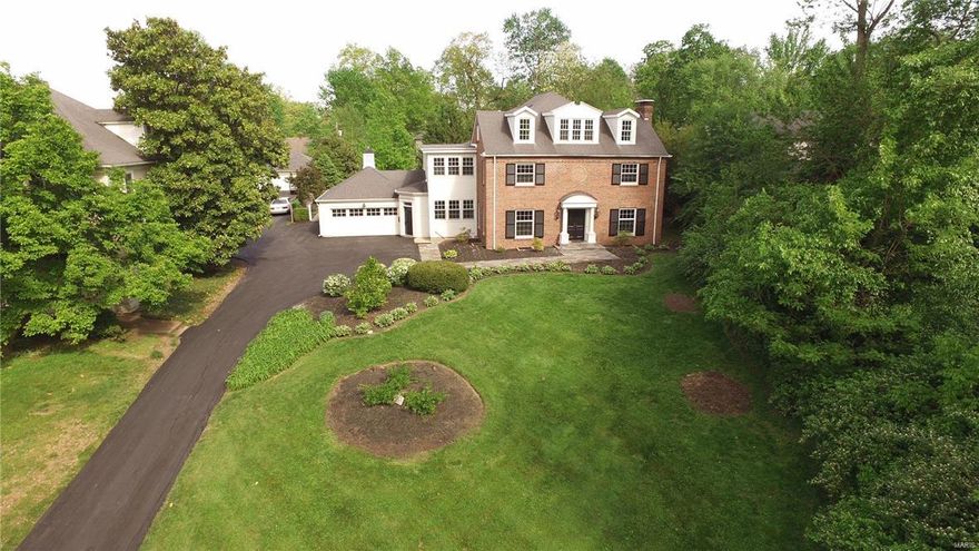 Est. 1950. Renovated 2.5 story Colonial with 6 bedrooms, 3.5 bathrooms is just a block from downtown Webster!  Perched on top of a hill, this beauty boasts gorgeous hardwood floors, extensive moldings/millwork, designer lighting, built-in sound system, high end finishes throughout.  Living room's French doors lead to stunning family room, custom stone mantle, built-in bookshelves. Double French doors lead out to exquisite veranda, flanked by 8 columns, flagstone woodburning fireplace. Deep, level backyard with soothing pond & waterfall.  Designer chef's kitchen with Subzero built-in fridge, Dacor 6 burner gas cooktop, custom cabinetry, granite counters, 7ft center island. Butler's pantry includes 2nd dishwasher, double Dacor ovens, beverage fridge, sink. Large mudroom with slate floors, built-in cubbies, sink. Spacious master suite with walk-in closet, walk-in shower with rain showerhead. 4 additional bedrooms/full bath on 2nd floor. 3rd flr has 6th bedroom, rec area with full bath. Additional Rooms: Mud Room