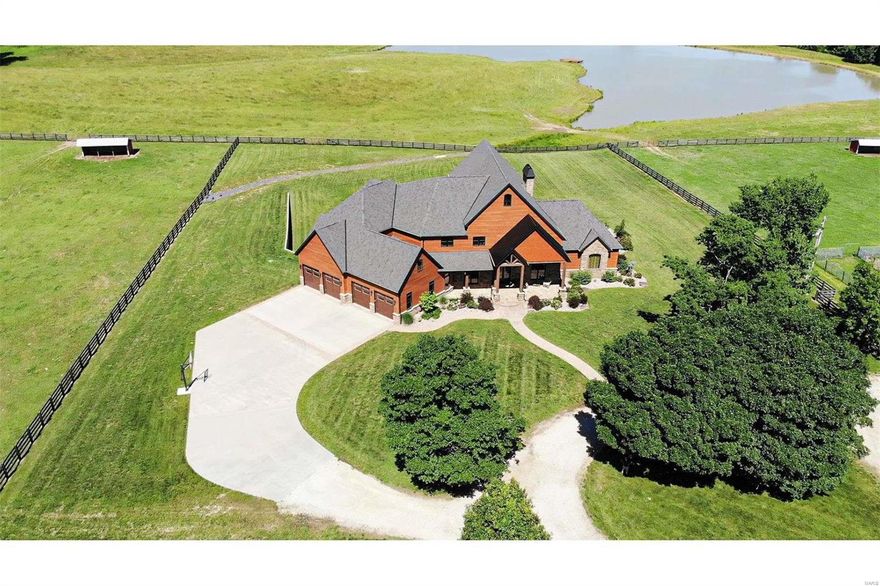 Rare opportunity to own one of the most magnificent properties in the area. Every inch of this farm, home & buildings has been custom built ! A beautiful gated entrance leads to this stunning 10,000 sq ft +\- home that features 5 bedrooms, 6.5 baths, office, gym, huge vaulted ceilings, 3 fireplaces, large walk in pantry, 4 car garage , finished basement, large swimming pool, gas stone firepit, landscaped to perfection and so much more! It is all sited on 78 acres m/l in St. Francois County. The land is mostly beautiful pastures, some woods and lots of wildlife. The great St Francois River runs through the property as well. You will love the 6 ac m/l stocked lake, which is spring fed !! If you are a horse lover , you will fall in love with the large custom 17 stall horse barn, it has it all !! Barn also features a 2150 sq ft living area. Detached hay barn, black board fencing, loafing sheds, automatic horse waters and so much more! Don't miss out on this one of a kind farm !