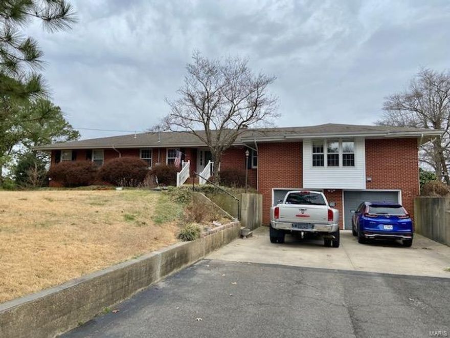 Take a look at this 3-4 Bedroom home located in a quiet neighborhood ! This over 4200 square foot brick home is move-in ready and sits on 2 Acres M/L in Kentwood Hills. This home features Beautiful pegged hardwood flooring on main level with carpets in Bedrooms. The minute you walk in you will feel at home in this large foyer that will lead you into the Kitchen/Breakfast area with enclosed Pantry ,a Jenn-air cookstove and new Refrigerator and Dishwasher. A Large living room with windows looking out over the 20x40 size pool with completed backyard fencing. The Den can be turned into that 4th bedroom that features a gas fireplace and private door leading out to sunroom and pool.  Downstairs you will find spacious living area with a wetbar, laundry room, an extra storage room and doors leading out to a double garage. Heat /Air unit installed in 2006 and New roof in 2009!