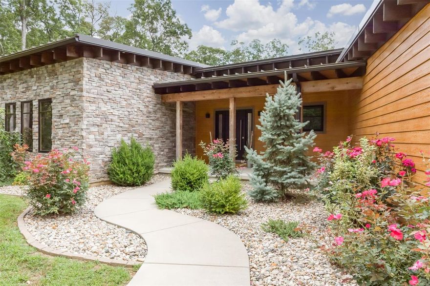 Are you looking for your own peaceful retreat? This custom home is everything that you’re looking for & more! The inviting & open floor plan is the perfect place to entertain your friends & family featuring wood beams, double sided stone fireplace, gorgeous kitchen with granite counter tops, center island with cozy seating & pantry. The great room has tons of natural lighting with scenic views of the 20 acres. Main floor master includes walk-in closet, built-in cabinets, a master bath you’re sure to love. His/her vanities & custom stone shower. The main floor also has two bedrooms, home office, mudroom & laundry. Lower level has 2nd master bedroom, bath 2 walk-in closets, Family room, rec room, secret safe room & storage. Outside patio area you’ll fall in love with the 2 covered patios and hot tub. Home’s exterior features seamless lock metal roofing, LP smart siding & stone finishing. Also included 54x46 detached garage it also has a small apartment & full bathroom!