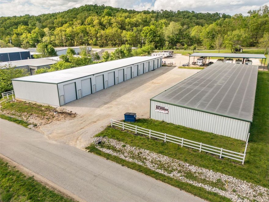 Spanning across 2.42 acres, with road access from two sides. Located in Linn Creek, Missouri of Camden County, this facility offers 59 total units across 20,800 net rentable square feet. Mid Missouri Big Storage is located in the business park of Linn Creek off of Highway 54. Mid Missouri Big Storage’s unit mix is comprised of 10x50s, 18x50s and outdoor parking both covered and non-covered to meet all boat and RV storage needs. Contractor units were added to the location in May of 2023, offering a rentable space of 900 square feet complete with plumbing and electrical for contractors use. Mid Missouri Big Storage is equipped with security cameras, perimeter fencing for parking and dusk to dawn lighting. Mid Missouri Big Storage is a stabilized, cash flowing asset, offering value-add opportunities through various forms including, but not limited to, increased rents, administrative fees, tenant insurance and management software, as well as room physical expansion. Location: City, Industrial Area