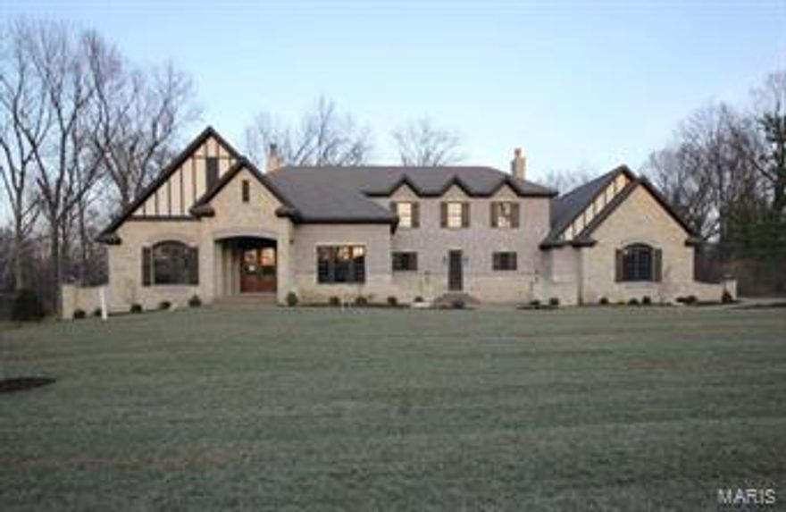 BACK ON MARKET THRU NO FAULT OF SELLER. Built by Kennerly Custom Homes on a gorgeous 1 acre lot. Brick & stone 4 sides. Huge 4 car o/s garage. Aggregate walks & drive. Marvin windows. Solid custom walnut entry door. 2 fireplaces. 3 piece crown through most of the house. 7 1/4” base t/o.  Fireplace, 12’ ceiling, & beam grid work ceiling in great room. Commercial grade appliances. Huge kitchen island with marble tops. Open to Hearth & Breakfast rooms. Butler pantry with bar sink & beverage center plus a 10x6 walk in pantry. 12’ door unit from hearth room to an 18x16 Veranda. Master with coffered ceiling, crown & rope lighting, walk in closet & fantastic bath with air tub & heated floors. Upstairs features a family room, 3 bedrooms with private baths & walk in closets, plus an 18x12 sitting area with cabinetry & beverage center. 4” Hardwood.  Family foyer, with cabinets, cubbies & powder room at garage entry. 3 zone HVAC. Full landscaping, sod, & sprinklers. Stereo & alarm.