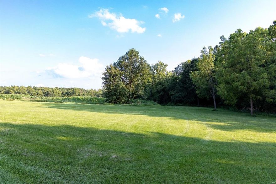 Very PRIVATE & SECLUDED 3 Bedroom, possible 4th, 3 full Bath 3,000 + Sq Ft Home with a PANORAMIC VIEW of over 107.79 acres of gently rolling cropland (68 acres TILLABLE) meadows, wooded draws, walnut trees, trails, active food plots, a 3/4 ac stocked lake, a SPRING FED CREEK w/pump house & an Amish built 40'x64' machine shed. NOW AVAILABLE & MOVE-IN READY!  Incredible 552 SqFt wrap-around deck, a 20 foot Vaulted Great Room, a handy 8'x3' Kitchen Island & Mannington Brand Vinyl Plank Flooring! Explore nature, the abundant wildlife, HUNT, FISH or just enjoy your privacy! This beautifully maintained property is definitely YOUR RETREAT, a family favorite for a weekend get-away, a vacation home or year round living with INCOME PRODUCING tillable acreage! IMAGINE yourself on the huge deck entertaining family & friends or just relaxing while quietly watching a sunrise or sunset, wildlife at play or the moon & stars far away from City lights & noise. Just a short drive down YOUR private lane! Some Accessible Features