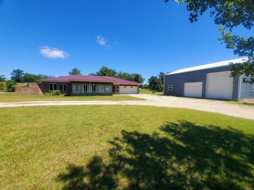 Just what you have been looking for - small acreage & an ideal location!  This property includes 4.9 acres that is approximately half timber with an efficient earth-berm home and a 32x40 shed.  With 2-3 bedrooms, 2.5-baths, and a large beautiful sunroom addition built in 2001, there is plenty of room for entertaining here.  You'll appreciate the open kitchen/dining area, which opens to the sunroom.  A handy back laundry/utility room also includes plenty of storage, and there is a small root cellar.  The 32' x 40' shed has 3 overhead doors, concrete floors,  and a finished area partitioned off for woodworking, all built in 2001. The location is half a mile down a gravel road off of Highway 6, just west of Highland High School.  This is a quick 30 minute drive to Quincy, IL, and not even 5 minutes to Lewis County C-1 Schools.

Utility providers here include REC Electric, Lewis County Water, Mark Twain High Speed Internet, propane (owned tank), and there is a lagoon.