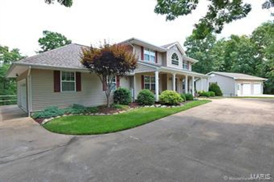 Custom 2 story home situated on almost 4 acres in Hillsboro School District includes a 34 x 26 detached garage/workshop that is heated and wired for a compressor - the perfect "MAN CAVE". Circle driveway highlights the beautiful landscaping throughout the property. 4 bedrooms and 3 1/2 bath. Separate dining room. Great room hosts built in shelves & wood burning fireplace. Gourmet kitchen with breakfast bar, newer Bosch dishwasher, planning desk & adjoining breakfast room. Your family will love the outdoor living space in the 26 x 12 screened in porch overlooking the park like setting yard, sure to see deer & turkey. The upper level includes luxury master suite with 2 large walk in closets & spa like bath. Two additional large bedrooms, full bath & bonus room. Finished lower level offering recreation room, bedroom, full bath & large mud/laundry area. Excellent location just minutes from highway and schools. Pride of ownership shows throughout!