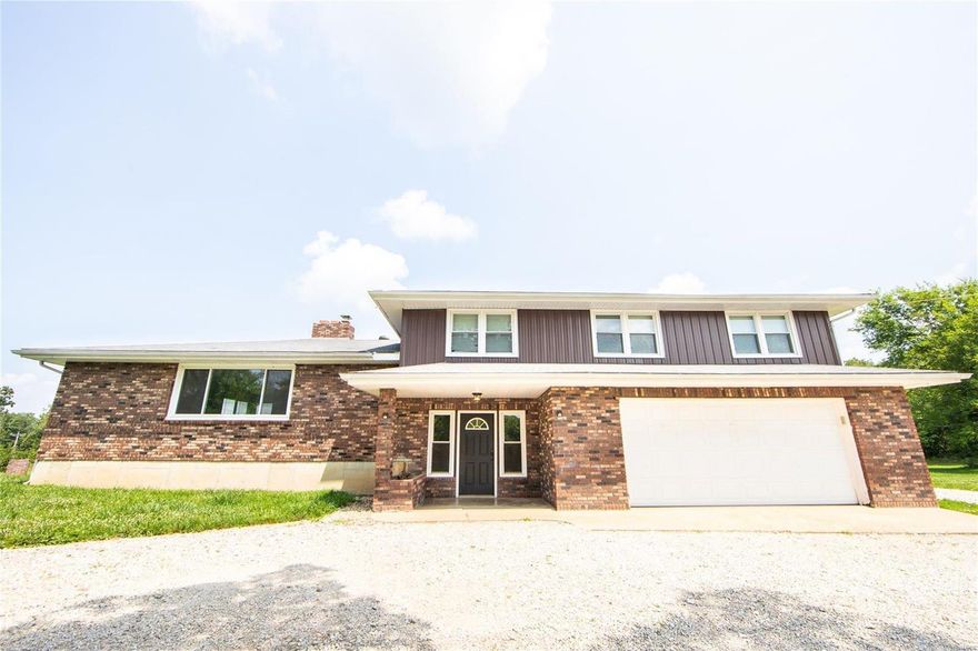 Multi-Level home on 5+/- beautiful acres. Home has been completely updated with new carpet, a new kitchen, stainless appliances, metal siding, and more. A partial unfinished basement walks up, a huge bonus living room/den, 2 car garage,  circle drive, chicken coop, garden shed, small pond, and some fencing. This large home is very private yet close to the highway and only minutes from anything you may need. Call today!!