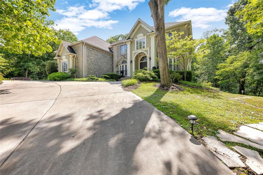 Stunning home on serene acreage; impressive two-story entry with custom millwork, archways, and French doors in dining room and sitting room; main floor bedroom with full bath; gourmet kitchen featuring custom cabinets, island with second sink, granite countertops, built-in KitchenAid refrigerator, Wolf gas range/oven, walk-in pantry; vaulted hearth room/breakfast room with stone fireplace; full glass sunroom with separate heating/cooling; built-in speakers; upper level spacious master suite with sitting room, see-through fireplace to luxury bath with steam shower and whirlpool, laundry in walk-in closet; two additional bedrooms with Jack and Jill bath; fourth bedroom with ensuite; fifth bedroom/bonus room; amazing lower level with separate entrance, bedroom, luxury bath, sleek high-end kitchen; exercise studio with full bath; gorgeous outdoor multi-level paver patio with lighting, fire pit; 400 amp service; public water/sewer. Close to shopping, parks, trails, schools, Town Centre. Additional Rooms: Mud Room