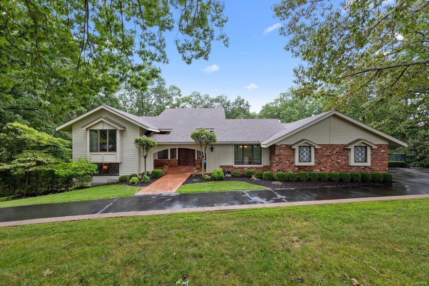 This stunning 3 bed/3.5 bath home sits on 2 wooded acres with a lake view. You'll love the open floor plan, with the step down GR with vaulted ceiling, custom lighting, gas FP and a wall of windows overlooking the lake. The Brooksbery kitchen remodel includes full wall height windows overlooking the private pool and lake, center island with sink, custom staggered cabinetry that extends to the ceiling and includes built in hutch and pantry. There's a Sub-Zero Refrigerator/Freezer, Viking dual fuel range, Sub-Zero wine cooler and refrigerator drawers + granite counters, new subway tile back-splash and custom, high end tile flooring in the kitchen and breakfast rm. The master en-suite has a luxurious bath with dbl sinks, sep tub and shower and his and her walk in closets. There's an office/ den with views of the private lake. Mid level has two more bedrooms with private baths and a lg laundry RM. The LL has a nice family/rec room. Gunite pool, Hardy siding, Deck, privacy at its best! COOL: 14 SEER+