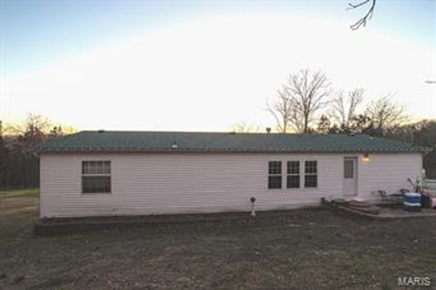 Great 4 bedroom, 2 bath home sitting on 1.37 acres, with a wood-burning fireplace located in the living room. Home backs to the woods adding privacy, a large deck in the front giving you gorgeous views!  Very large garage/outbuilding/workshop. New roof just put on last year! Well pump has a 5 year transferrable warranty! Easy access to Highway 67, only minutes from shops and restaurants in Festus and De Soto!