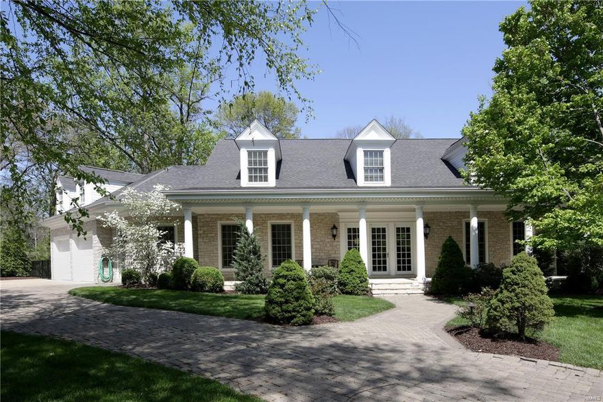 Built by Jim Minton and just 12 years new, the inviting front porch will draw you in to this outstanding 2-story custom home with incredible details. Offering an entertainer's paradise at its best, this 4+ bedroom, 4.5 bath home is sophisticated yet comfortable balancing soaring 10' ceiling and beautiful open spaces. The slate entry allows front to back views that open to dining room and cozy paneled library with fireplace, sunny great room with fireplace, wet bar and French doors to new patio with gas grill and outdoor fireplace. Fabulous kitchen with breakfast bar adjoins the hearth room with box beamed ceiling and breakfast room with patio access. The spacious 1st floor master suite has luxury bath and large custom closet. Upstairs are 3 gracious bedrooms with walk-in closets and generous office/playroom. Lower level has new wine cellar, family area, full bath w/ steam, exercise room and tons of storage. Perfect Executive home with over 5000 sq. ft. and 1400 finished in lower level.